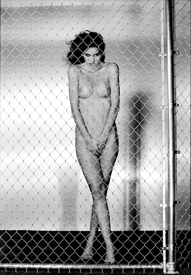 Gia Carangi infamous fence photo published in the book Fashion Theory.  Photographer Chris von Wangenheim.